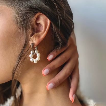 Hoop earrings with dangle pearl pendant in silver tone