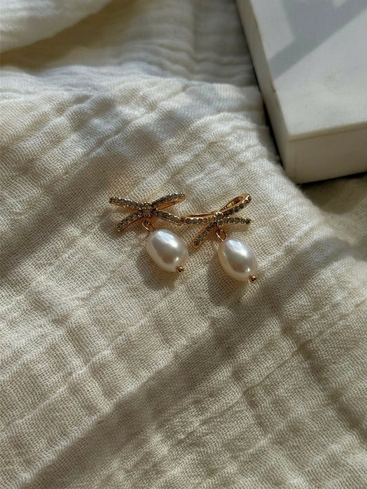 Pearl Drop Bow Earrings with diamonds in gold shade
