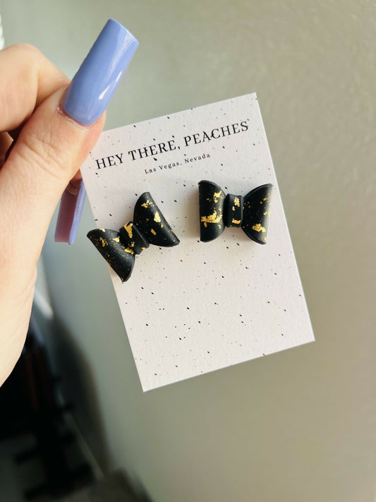 Black and gold flake bow studs